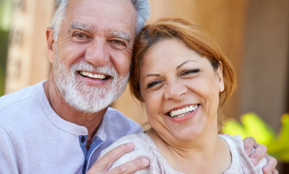 couple smiling after visiting Hyattsville dentist Dr. Arrindell at Centro Dental Las Americas